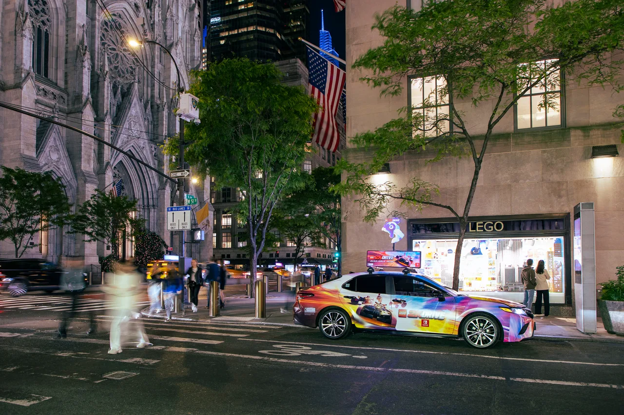 LEGO 2K Drive running on a full wrap with digital top at Fifth Avenue at 51st, LEGO flagship, New York, 2023