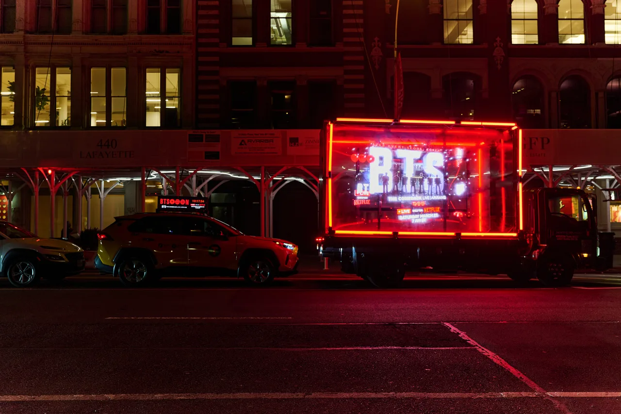 BTS on Netflix running on a glass truck at Lafayette Street, NoHo, New York, 2026