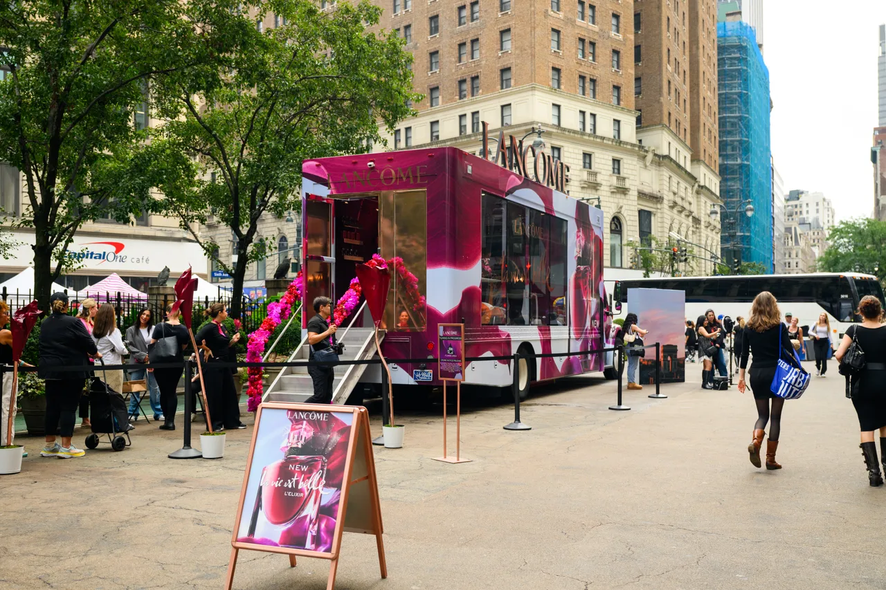 Lancôme running on a branded vehicle activation at Sixth Avenue, Midtown, New York, 2025