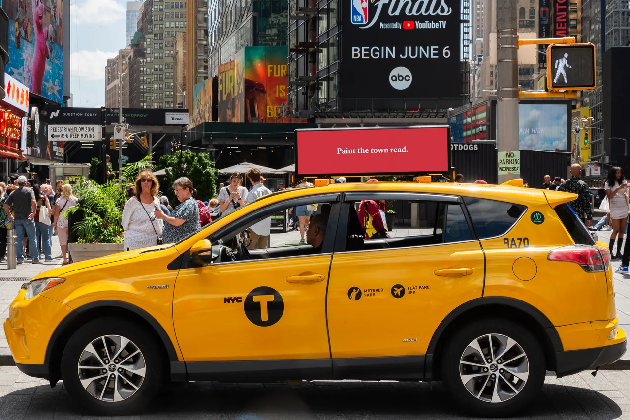 The Economist running on a digital top at Times Square, New York, 2024