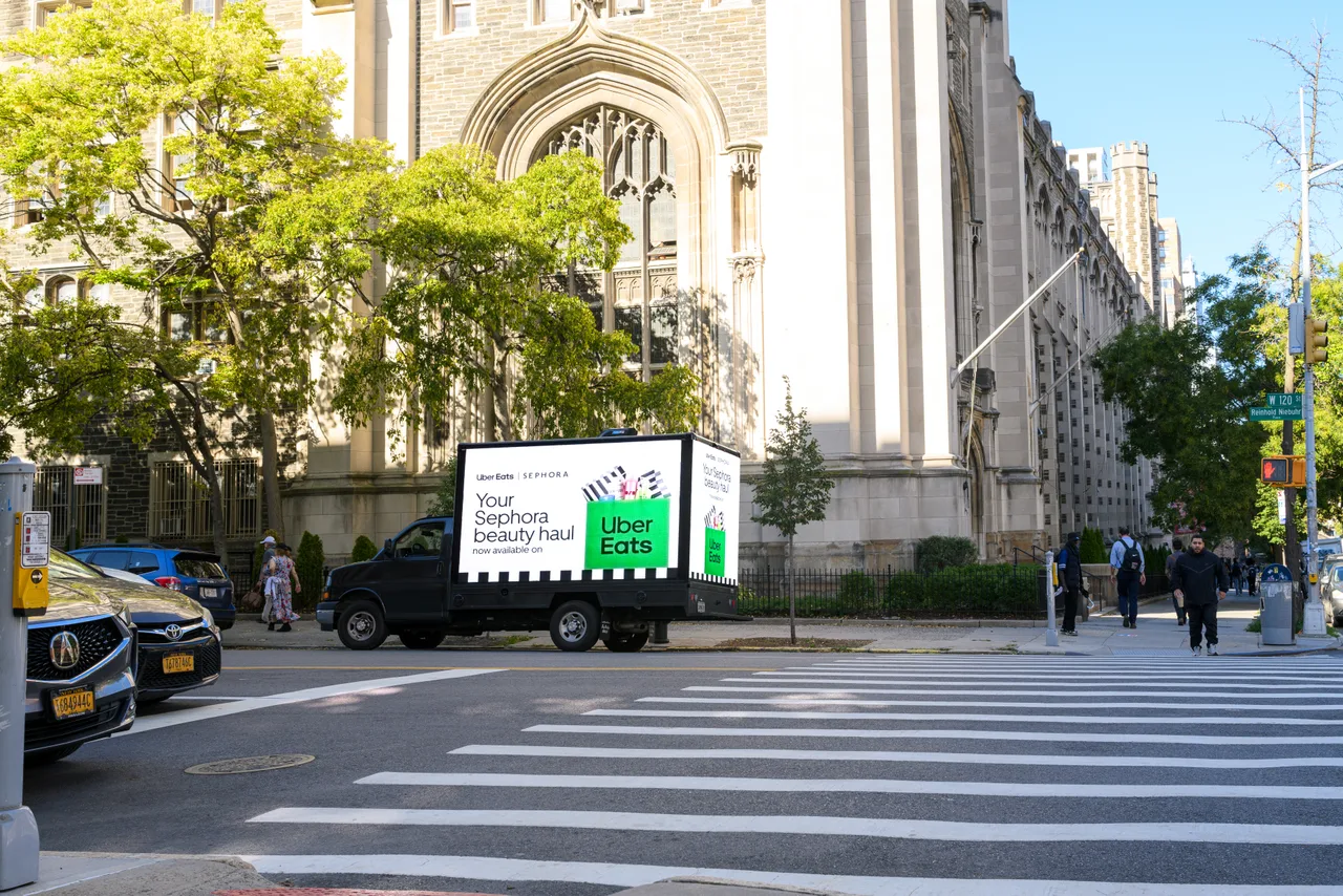 Uber Eats with Sephora running on a mobile billboard truck at West 120th Street, Morningside Heights, New York, 2025