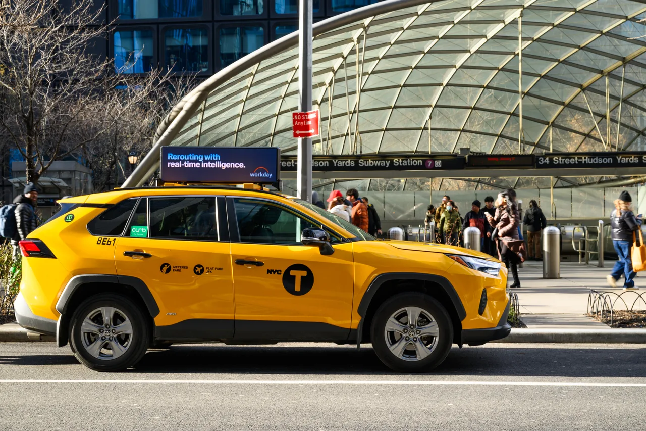 Workday running on a digital top at 34 St–Hudson Yards station, New York, 2025